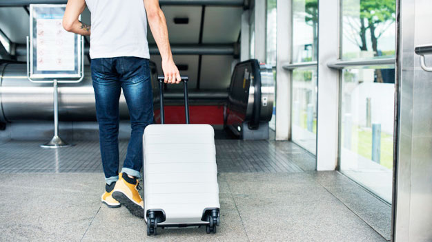 Man dragging his luggage