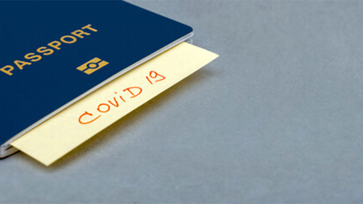 a picture of a passport with a note written covid19 inside